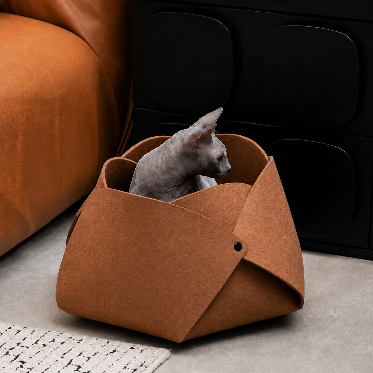 Sphynx cat sitting inside the caramel Felt Flower Cat Cave Bed