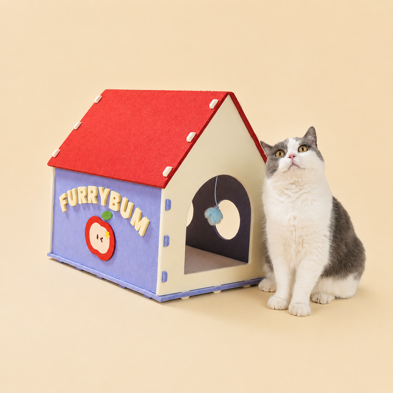Red House Cat Cave with red roof beside gray and white cat