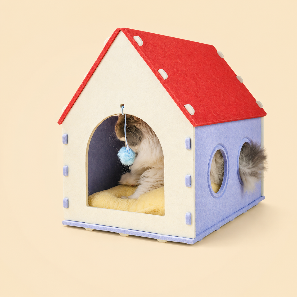 Red House Cat Cave with cat inside playing with blue dangle toy
