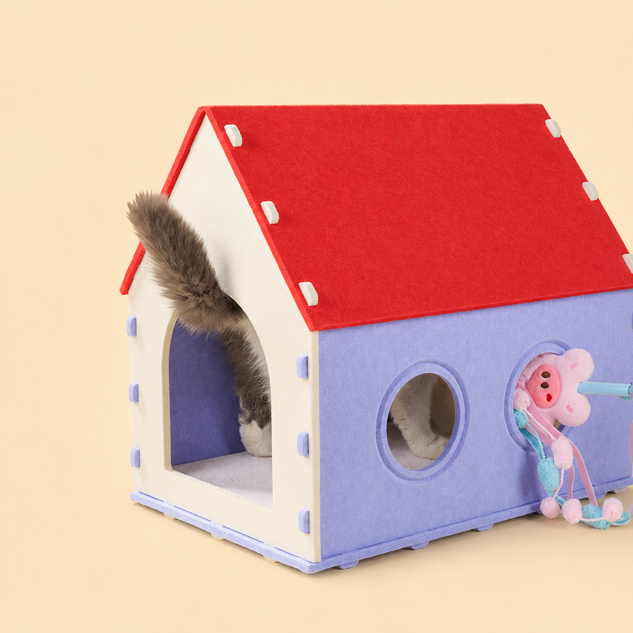 Red House Cat Cave side view with cat inside and dangling toy