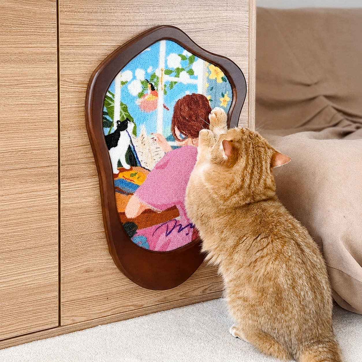 Close-up of orange cat scratching Reading Time Art Print Cat Scratcher on cabinet