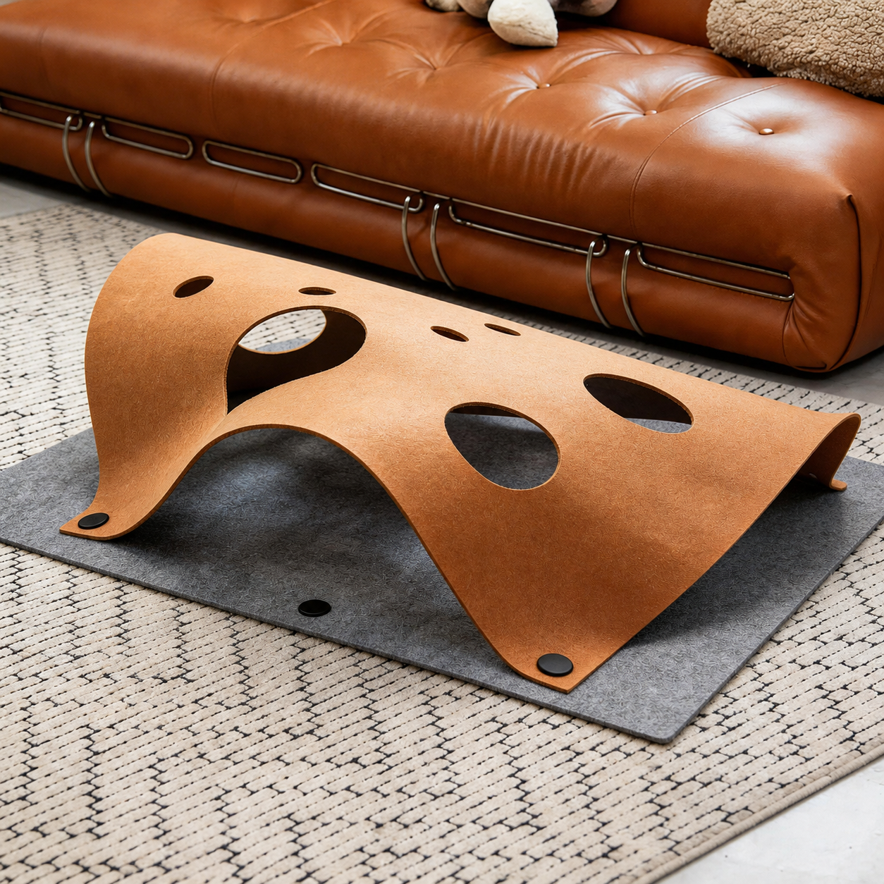 Caramel Prowlet Felt Play Mat with gray base in living room