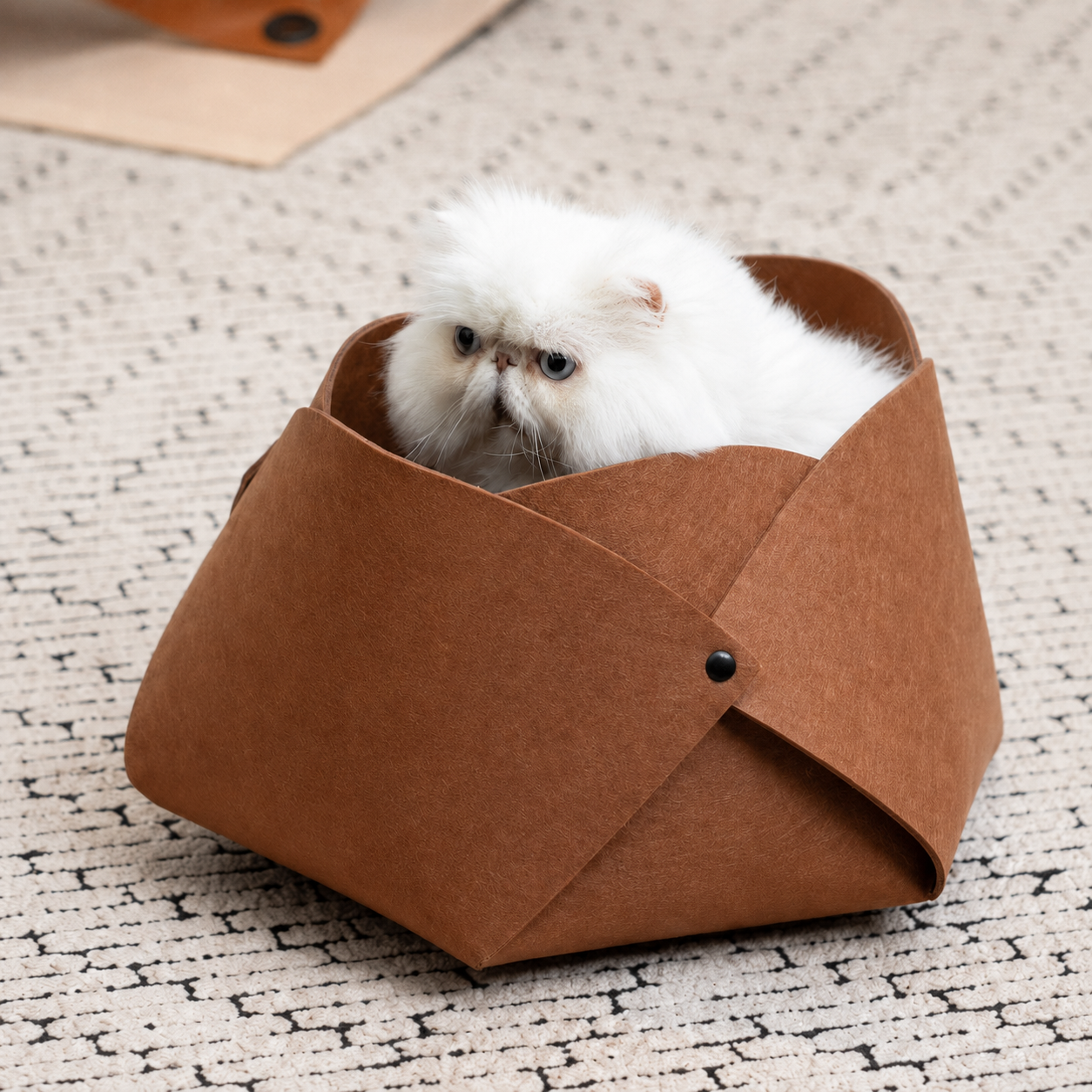 White cat resting inside the caramel Felt Flower Cat Cave Bed